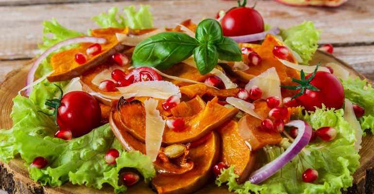 salad of roasted pumpkin and pomegranate cherry tomatoes